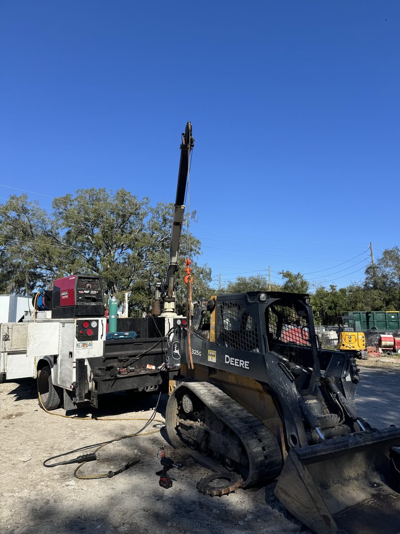 Our service truck working on a John Deere track loader